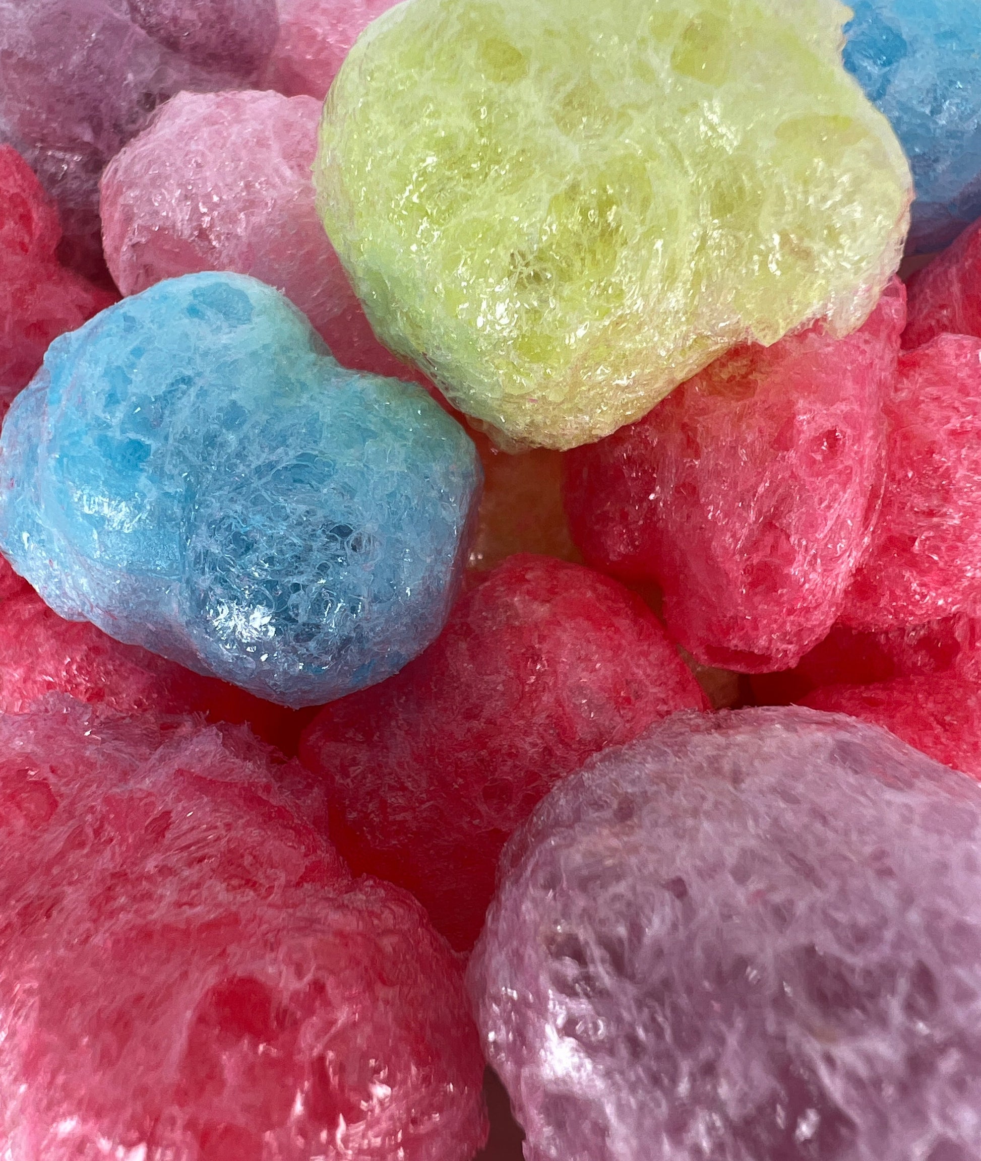 Close-up of colorful gumdrops with a white background